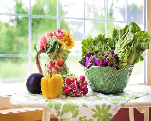 Fresh healthy vegetables and fruits on a kitchen table